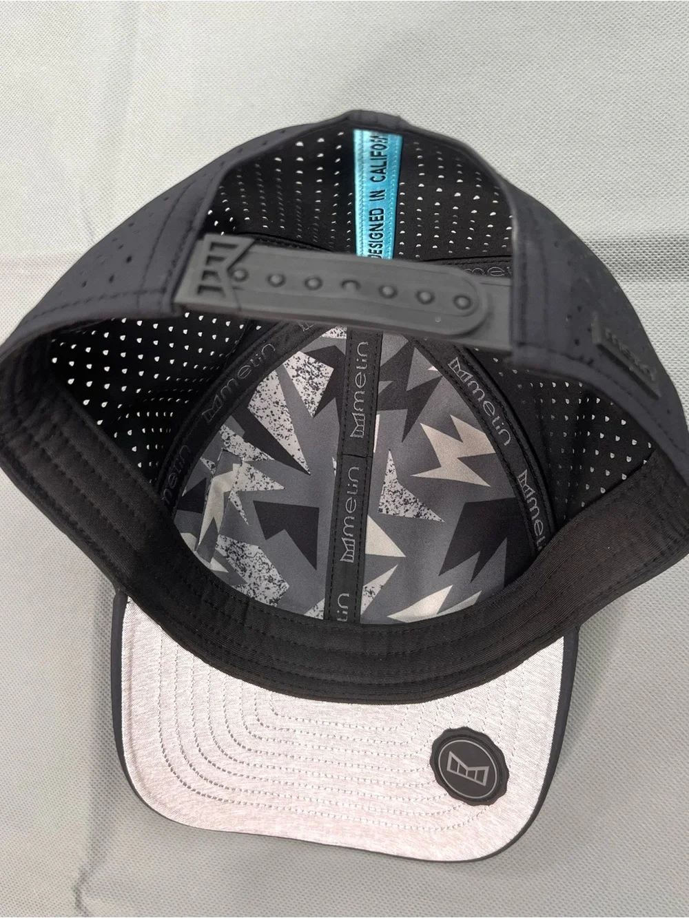 Melin x Vessel Golf Hat A-Game Hydro Snapback Cap Black Classic Fit